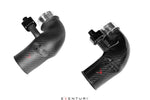 Two curved carbon fiber intake tubes with polished aluminum couplers and black fittings on white background - Eventuri turbo inlet for BMW G90 G99 M5