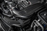 Carbon fiber intake system installed in engine bay with curved ducts and airbox assembly - Eventuri intake for Mercedes-Benz C63