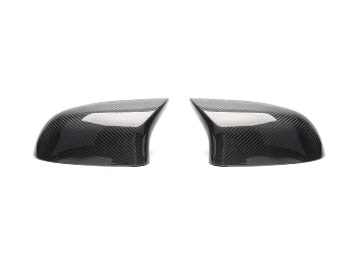 A front view of AUTOTECKNIC M-INSPIRED CARBON FIBER MIRROR COVERS - BMW F25 X3 LCI | F26 X4 | F15 X5 | F16 X6 2010-2019 with white background