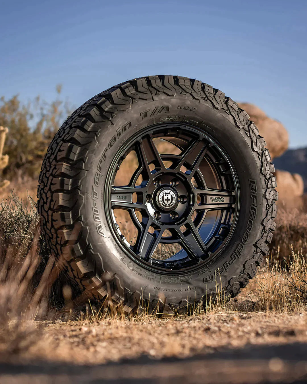 A front view of HRE FlowForm FT1 Wheels on the ground outside