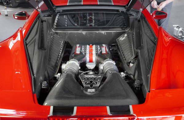 wide view of Capristo Carbon Lock Cover for Ferrari 458 Speciale 2013-2015 fitted inside a car