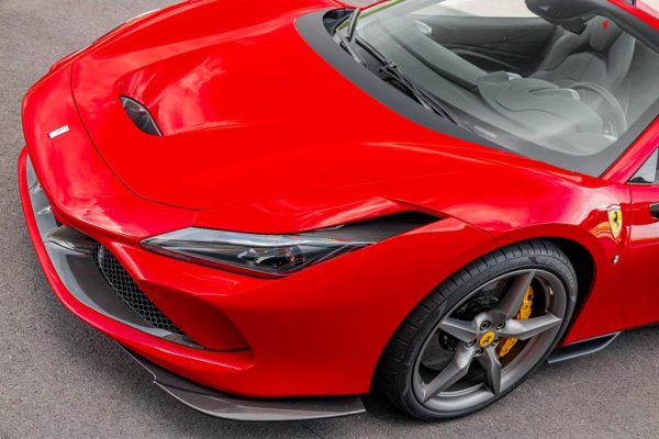 close and wide front view of Capristo Carbon Fiber Side air guides (L/R) F8 2019-2023 fitted in car