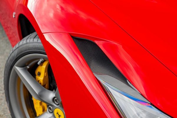 close view of Capristo Carbon Fiber Headlight Air Vents For Ferrari F8 2020-2022 fitted inside a car