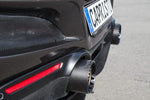wide view of Capristo Carbon End Pipe Shells For Ferrari F8 2019+ fitted inside a car