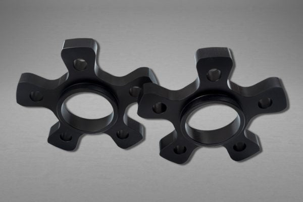 close front view of Capristo Wheel Spacers 11mm Front / 17mm Rear (Star Shape) with Titanium Wheel Bolts for Ferrari Portofino 2017–2020 with grey background