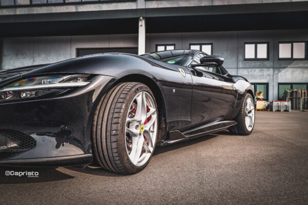 wide side view of Capristo Carbon Fiber Side Skirts (with Large Fin) for Ferrari Roma 2020-2024 fitted inside a car