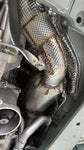 Capristo heat-wrapped sport cat downpipe installed on a Ferrari 12Cilindri, seen from below