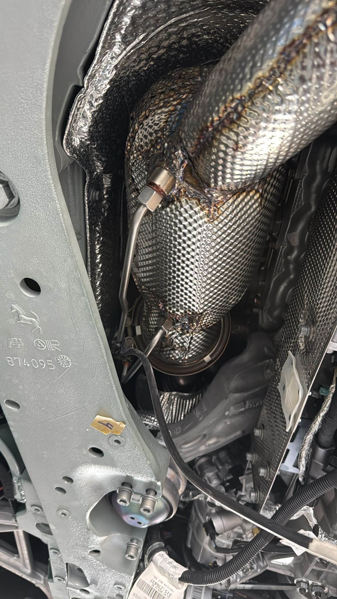 Capristo sport cat downpipe with sensor line fitted in the 12Cilindri engine bay