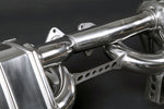 Close-up of polished muffler and bracket on Capristo Ferrari 288 GTO exhaust