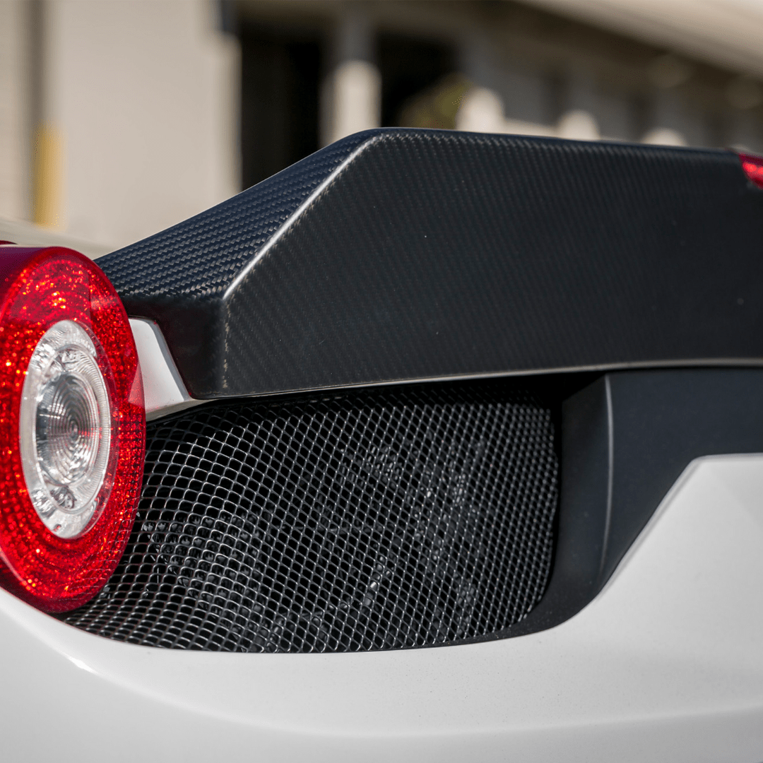 VX decklid spoiler edge and round taillight, close-up