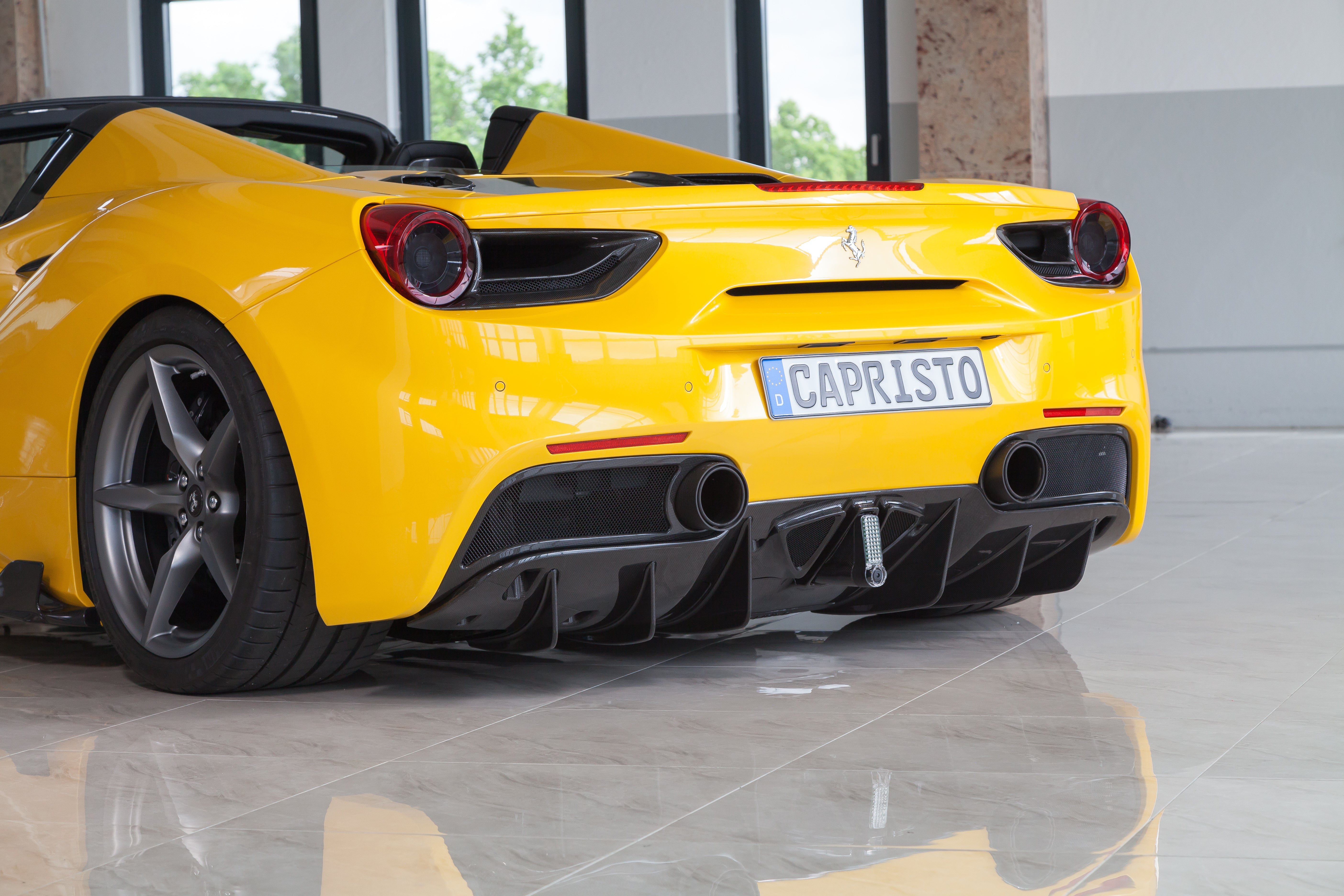 Yellow Ferrari 488 rear three-quarter with Capristo carbon fiber rear diffuser