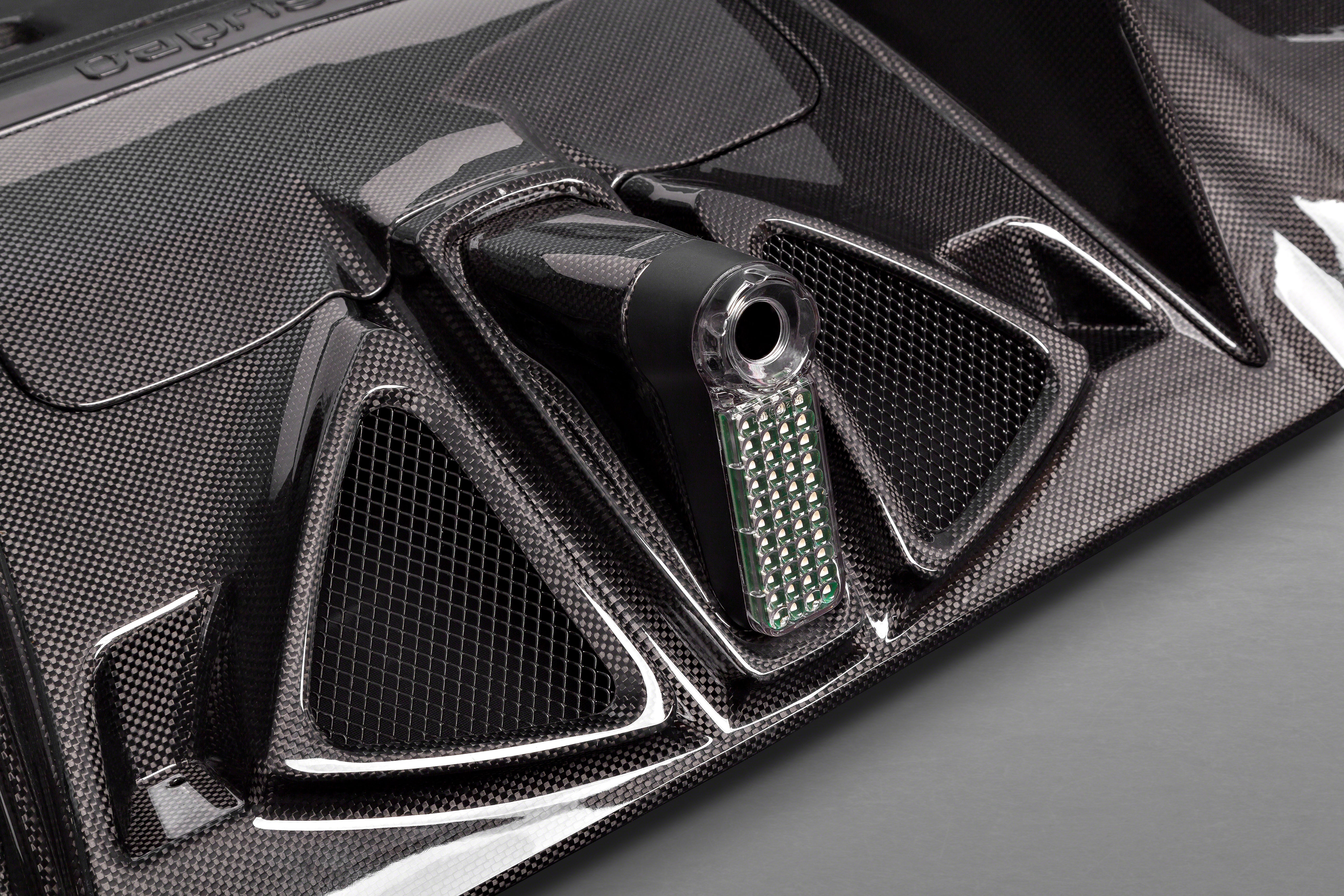 Close-up of carbon weave and mesh openings on Capristo Ferrari 488 diffuser