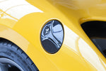 Capristo carbon fiber gas cap for the Ferrari 488 on a yellow car