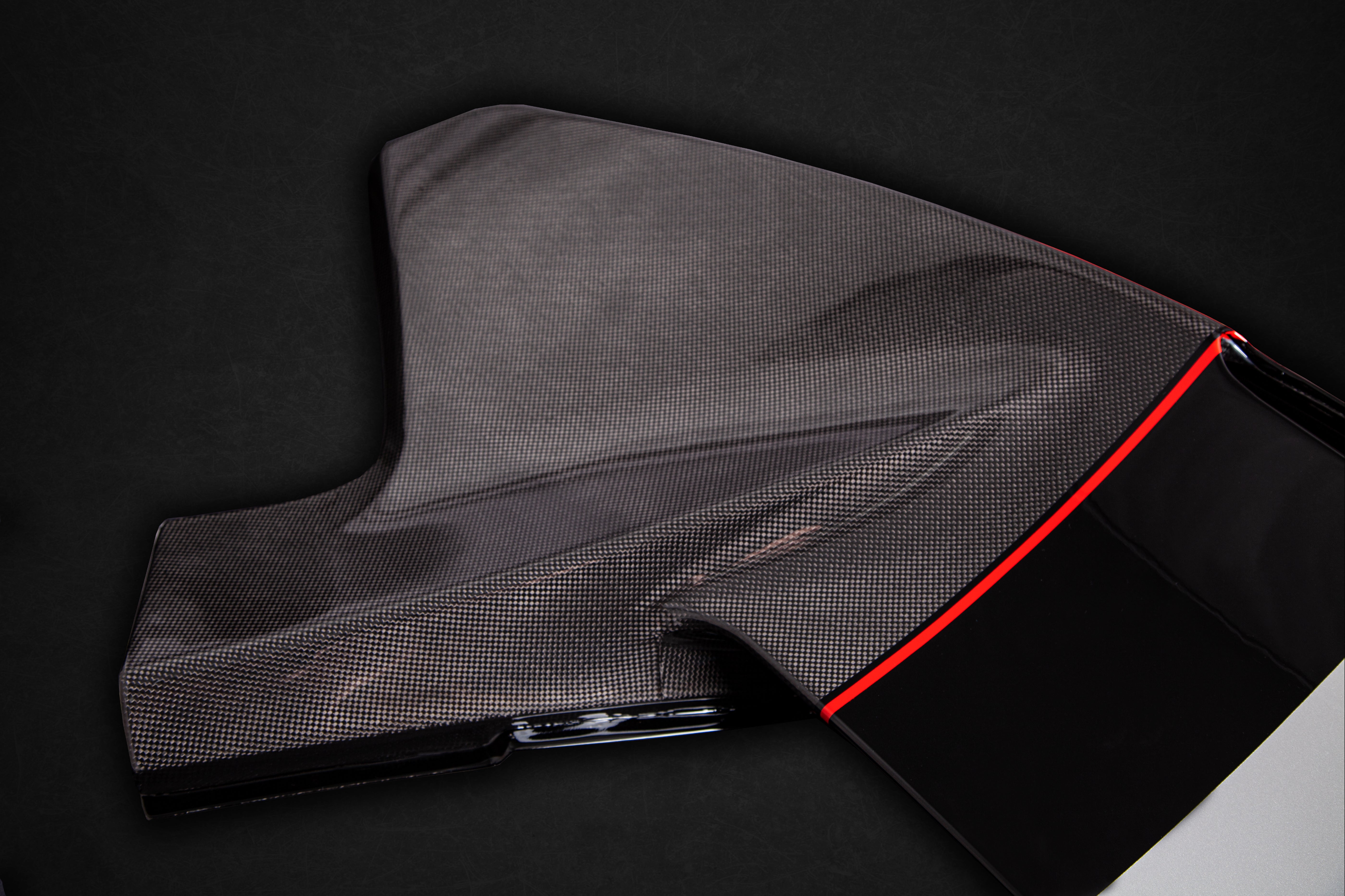 Close-up of Capristo 488 Pista wing endplate in exposed carbon
