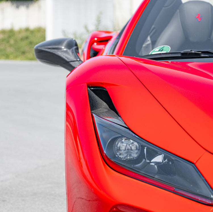 Capristo carbon fiber headlight air vent on a red Ferrari F8