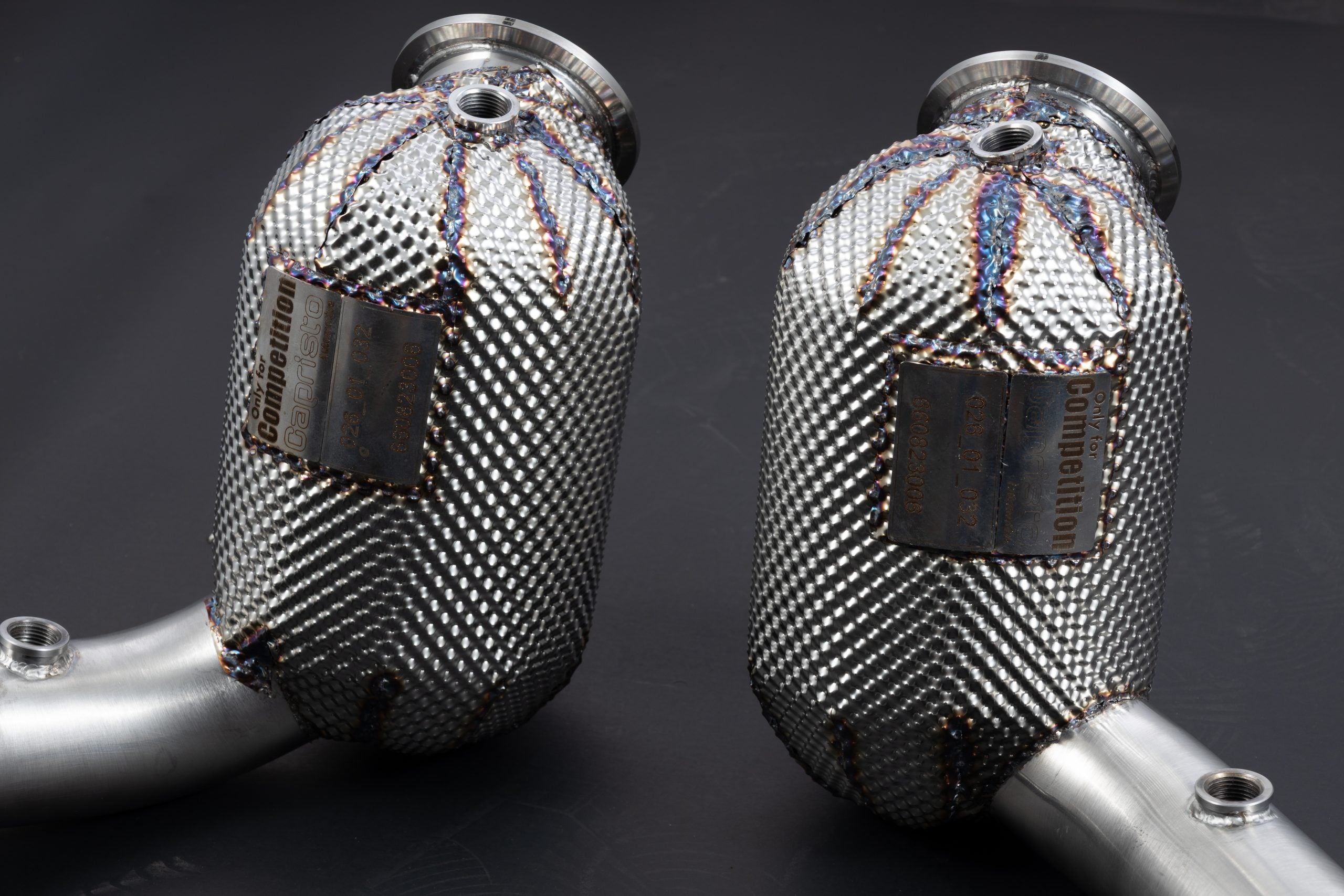 Heat-protected downpipes housings with V-band inlets and sensor bungs, Ferrari Roma