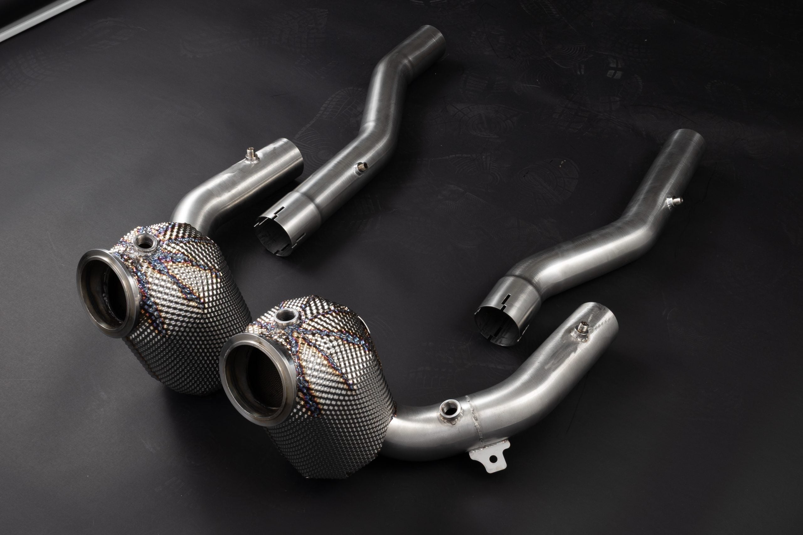 Capristo Roma downpipes with outlet pipes, angled view