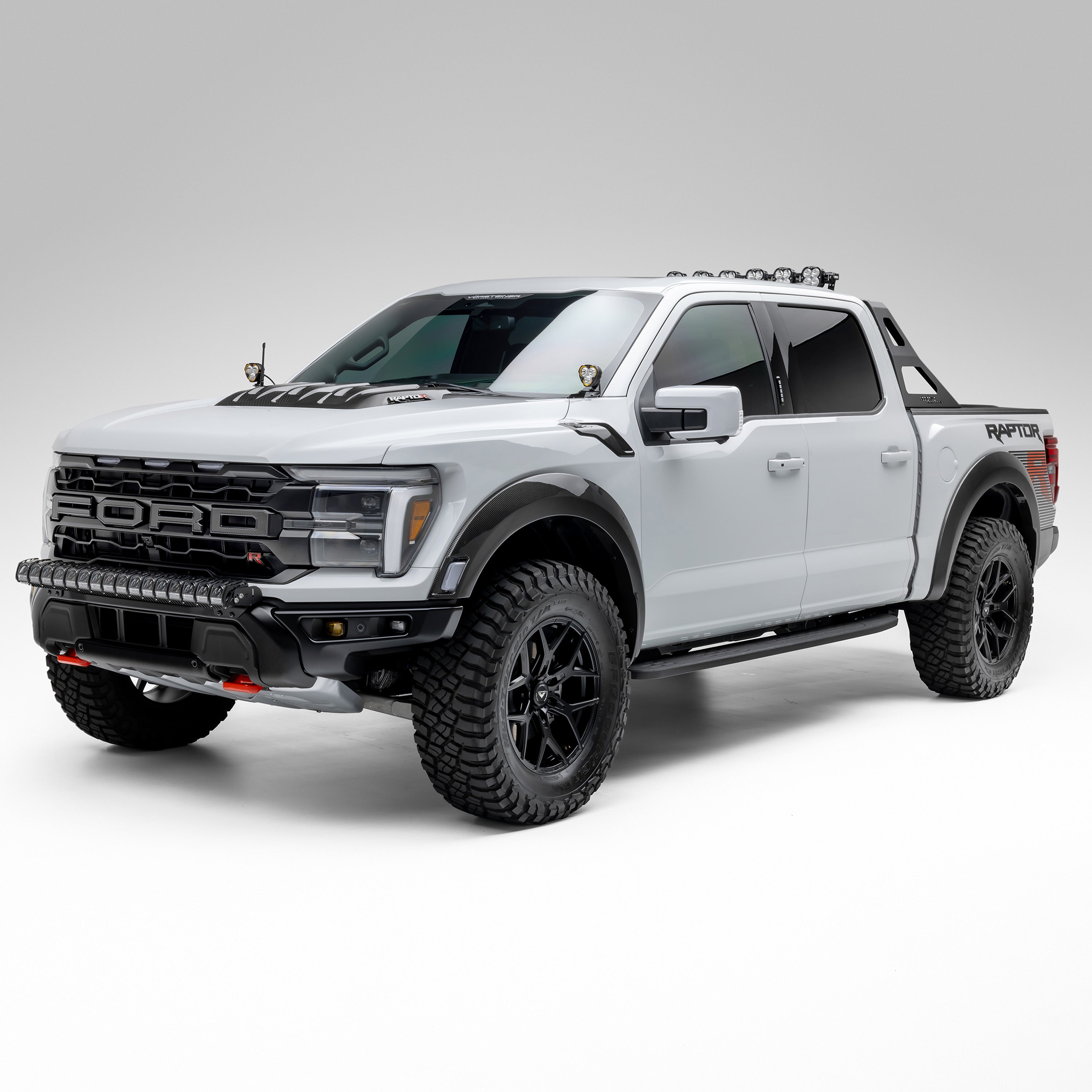 Ford F-150 Raptor R fitted with carbon fender flares, front 3/4 low
