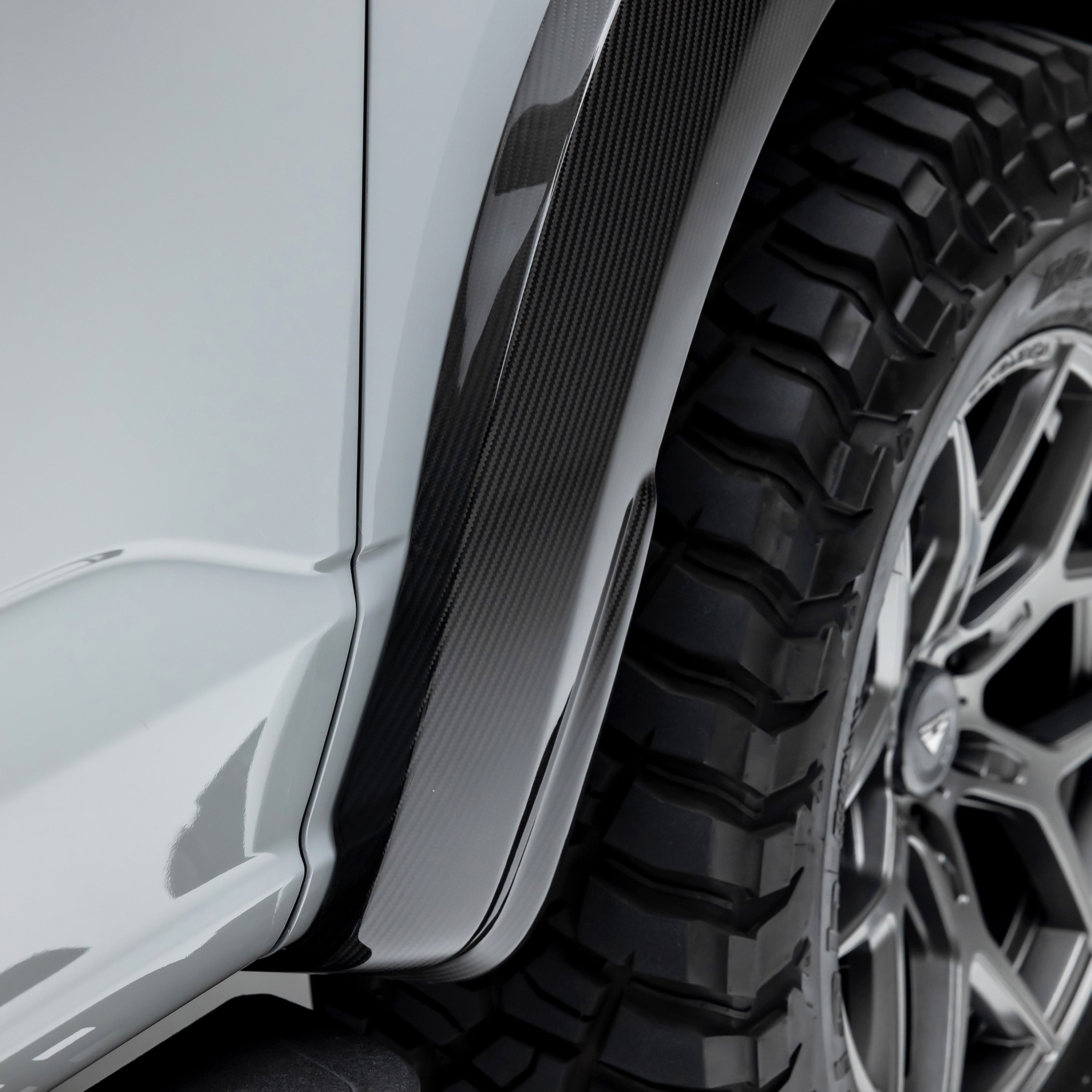 Carbon fender flare edge on Raptor R, angled close-up