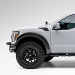 White Raptor R with carbon fender vents, front 3/4 view