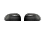 A front view of AUTOTECKNIC REPLACEMENT DRY CARBON MIRROR COVERS - BMW G05 X5 | G06 X6 | G07 X7 2018+ with white background