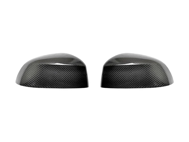 A front view of AUTOTECKNIC REPLACEMENT DRY CARBON MIRROR COVERS - BMW G05 X5 | G06 X6 | G07 X7 2018+ with white background