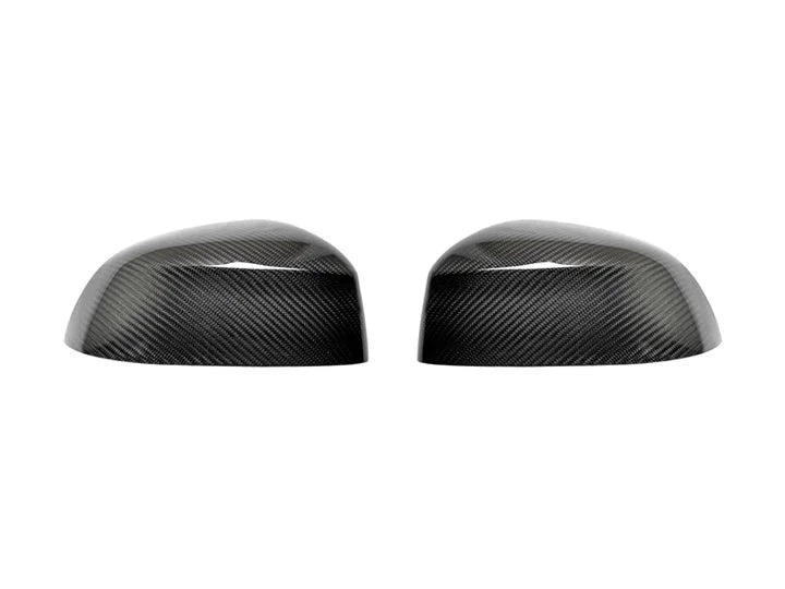 A front view of AUTOTECKNIC REPLACEMENT DRY CARBON MIRROR COVERS - BMW G05 X5 | G06 X6 | G07 X7 2018+ with white background