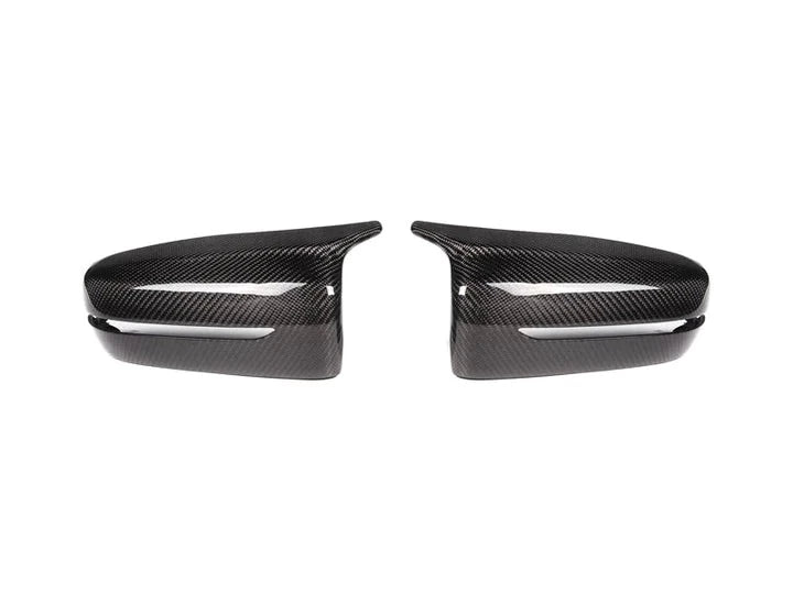 A front view of AUTOTECKNIC M-INSPIRED CARBON FIBER MIRROR COVERS - BMW G22 4-SERIES 2020+ with white background