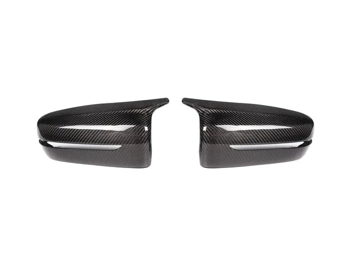 A side view of AUTOTECKNIC M-INSPIRED CARBON FIBER MIRROR COVERS - BMW G14/ G15/ G16 8-SERIES 2019+ with white background