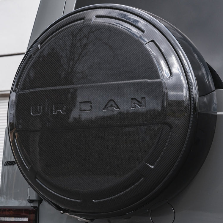 A back view of a car fitted with Urban Automotive Carbon Fiber Rear Wheel Cover Mercedes-Benz G Wagon 2018+