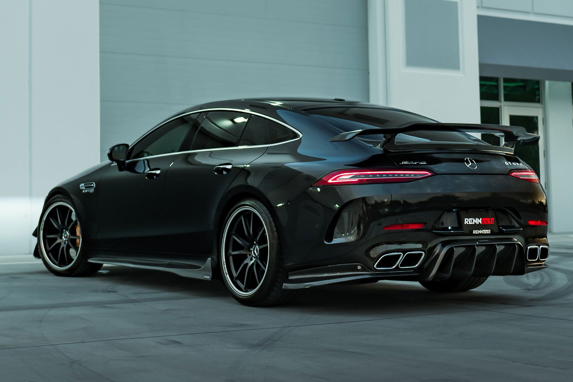 Black AMG GT 4-Door car rear three-quarter with the A1 kit - Carbon Fiber Side Skirts for the 2019-2026 AMG GT 63 4-Door Coupe