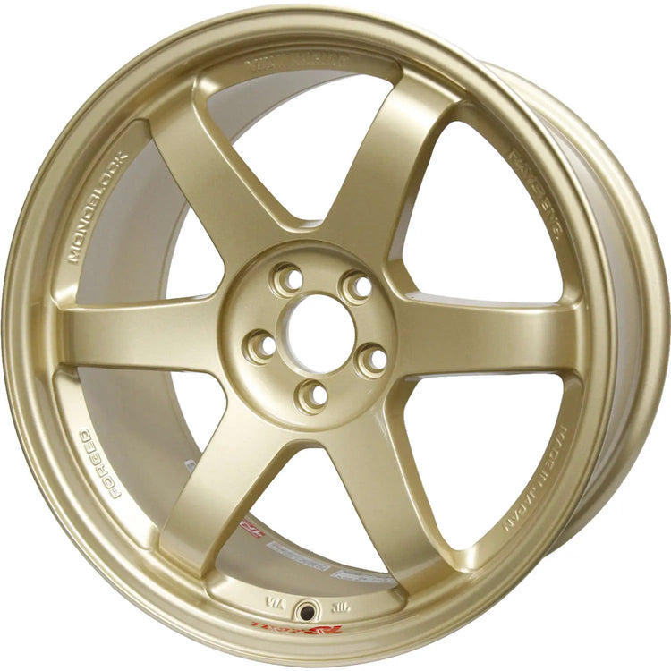 A front view of Volk Racing TE37SL Wheel 18x9.5 5x100 40mm Gold with white background