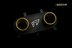 A front wide view of the gold tips of the IPE SS Titanium Cat-Back Exhaust System for Ferrari 458 Italia / Spider 2010-2015 with black background