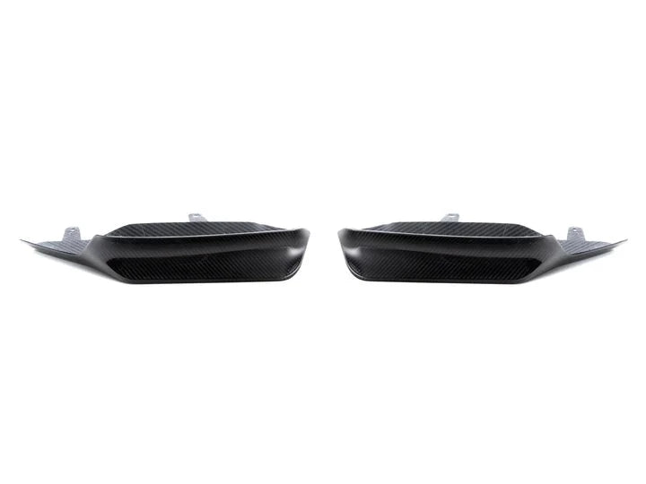 A front view of AUTOTECKNIC DRY CARBON PERFORMANTE AERO SPLITTER & CENTER LIP SET - BMW F97 X3M | F98 X4M 2019+ with white background