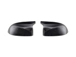 A front view of AUTOTECKNIC REPLACEMENT DRY CARBON MIRROR COVERS - BMW F97 X3M | F98 X4M 2019+ with white background