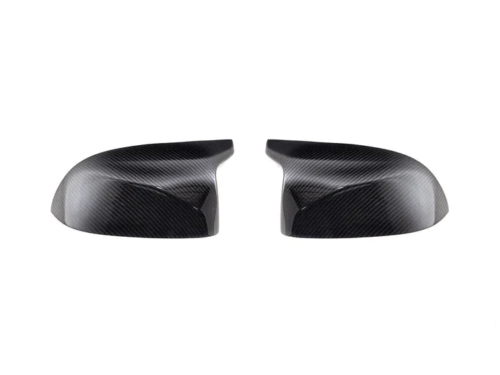 A front view of AUTOTECKNIC REPLACEMENT DRY CARBON MIRROR COVERS - BMW F97 X3M | F98 X4M 2019+ with white background