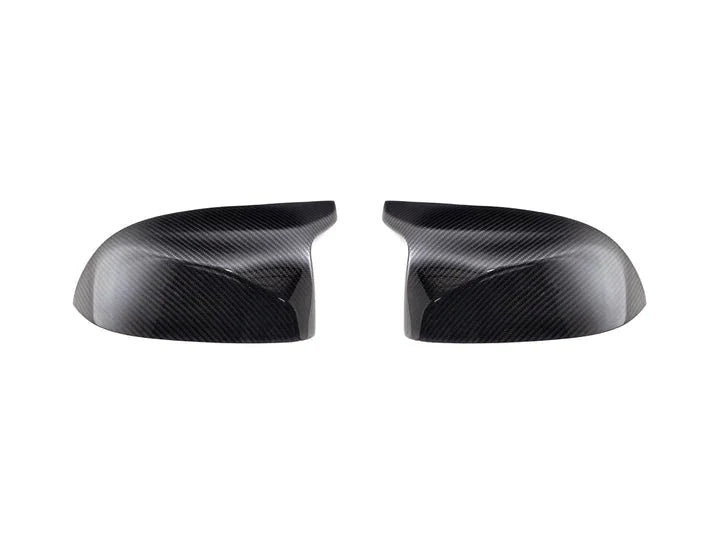 A front view of AUTOTECKNIC REPLACEMENT DRY CARBON MIRROR COVERS - BMW G07 X7 M60I 2022+ with white background
