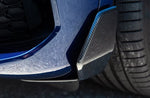 A sıde close up vıew of AUTOTECKNIC DRY CARBON FRONT WINGLET SPLITTERS - BMW G05 X5 M-SPORT 2019+ fıtted on a blue car