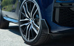 A close up vıew of the sıde of a blue car fıtted wıth AUTOTECKNIC DRY CARBON FRONT WINGLET SPLITTERS - BMW G05 X5 M-SPORT 2019+