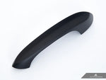 A side view of AUTOTECKNIC CARBON FIBER DOOR HANDLE TRIMS - TOYOTA A90 SUPRA 2020+ with white background