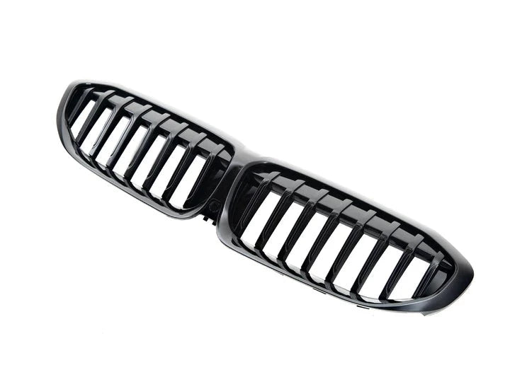A side wide view of AUTOTECKNIC PAINTED GLAZING BLACK FRONT GRILLE - BMW G20 3-SERIES 2018+ with white background