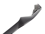 A close up view of AUTOTECKNIC DRY CARBON COMPETITION FRONT AERO LIP - BMW F87 M2 COMPETITION 2018+ with white background