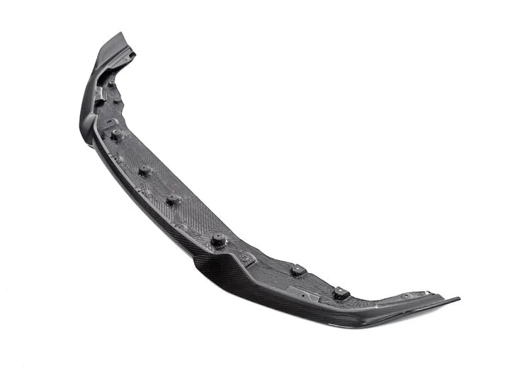 A side wide view of AUTOTECKNIC DRY CARBON COMPETITION FRONT AERO LIP - BMW F87 M2 COMPETITION 2018+ with white background