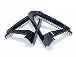 A top view of AUTOTECKNIC CARBON FIBER SPEAKER TWEETER COVER for BMW models with white background