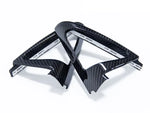 A top view of AUTOTECKNIC CARBON FIBER SPEAKER TWEETER COVER for BMW models with white background