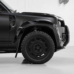 Close-up of an Urban WX4 satin black wheel on a Defender front corner (arch extension shown is not included)