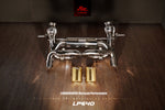 A top view of Fi EXHAUST Valvetronic Cat-Back System for Lamborghini Huracan Performante LP640-4 2017-2019 on a wooden floor