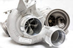 A close up view of Pure Turbos BMW S63tu F90 Pure 900 Upgrade Turbos with a white background