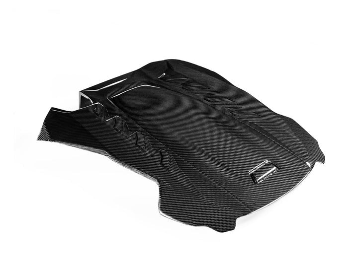 A front view of AUTOTECKNIC CARBON FIBER ENGINE COVER - BMW F95 X5M | F96 X6M 2019+ with white background