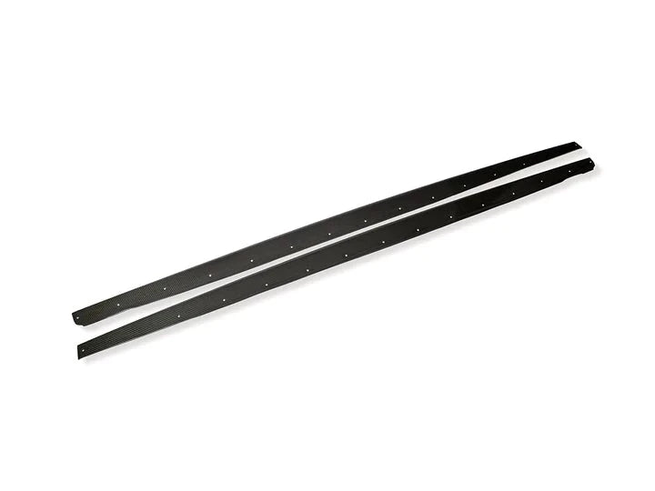 A wide view of AUTOTECKNIC DRY CARBON FIBER SIDE SILL SET - BMW F97 X3M | F98 X4M 2019+ with white background